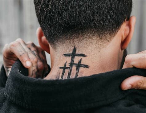 cross on the neck tattoo|cross neck tattoos for women.